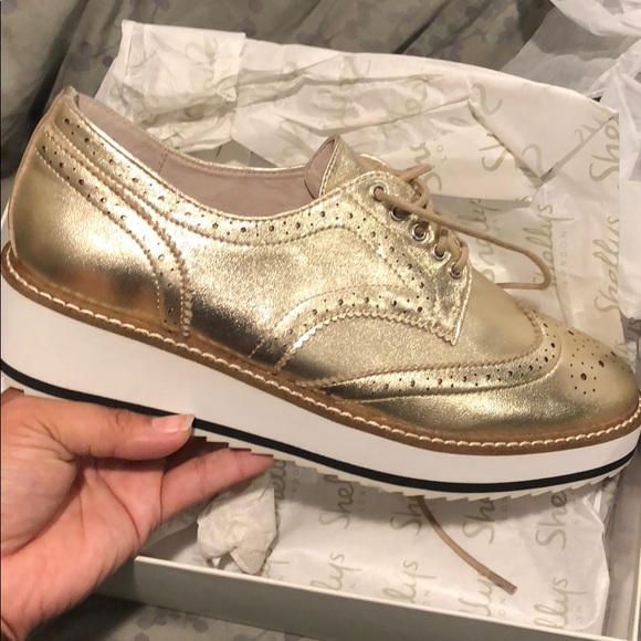 gold platform brogues